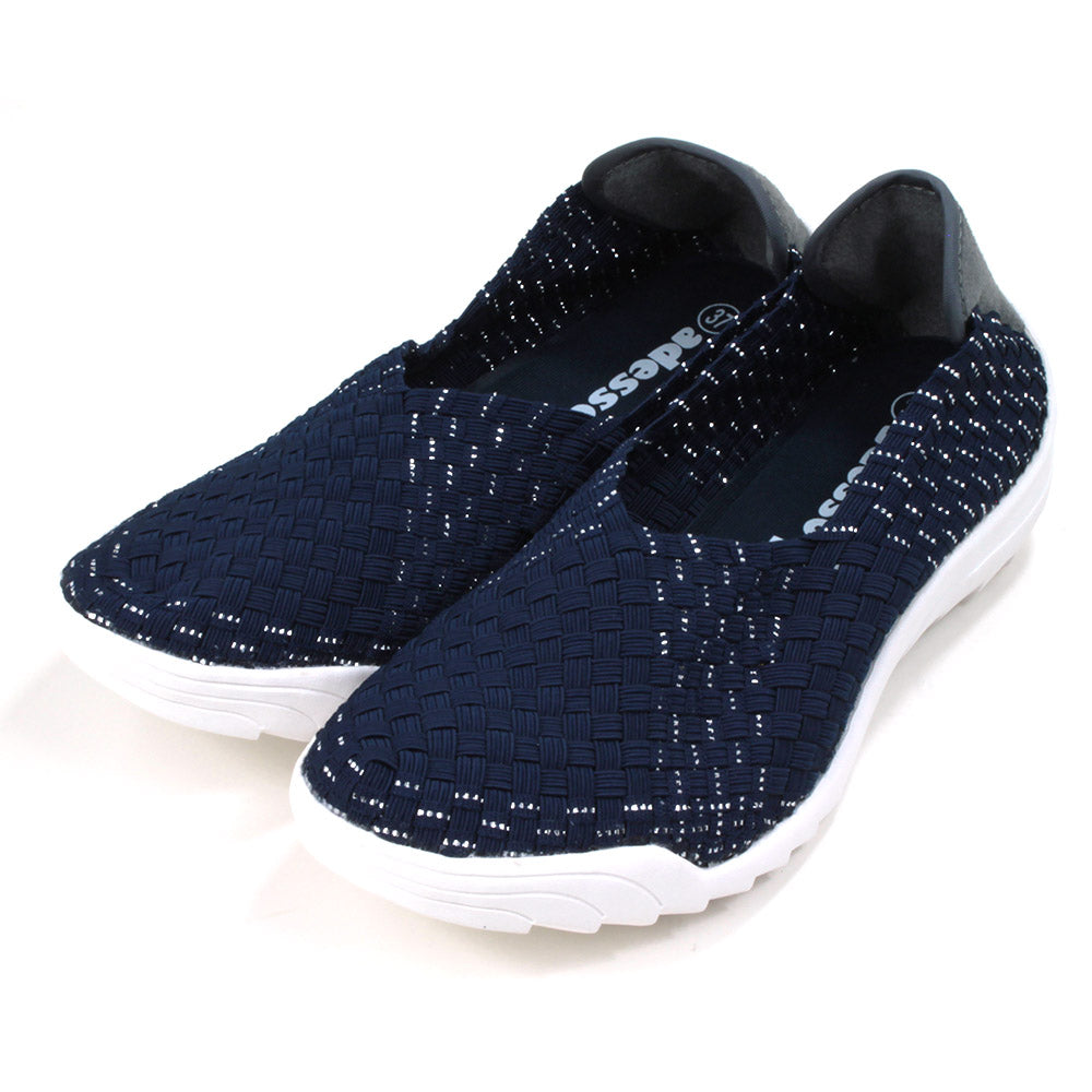 Navy blue woven fabric shoes with white rubber soles. Angled view.
