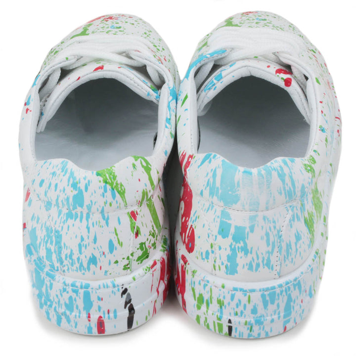 Leather white trainers with paint splash decoration. Six hole lace ups. Back view.