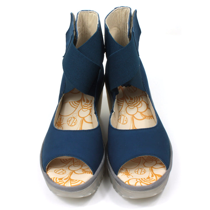 Fly London blue Cupido sandals with high ankle straps. Semi translucent platforms and  raised heels. Front view