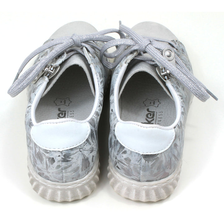 Rieker trainers in silver floral pattern. Lace up adjustment and zip fitting. Back view.
