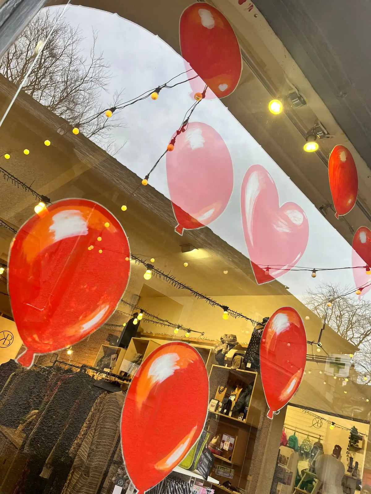 Ballons hand painted on the windows at Kitty Brown by Trueman.