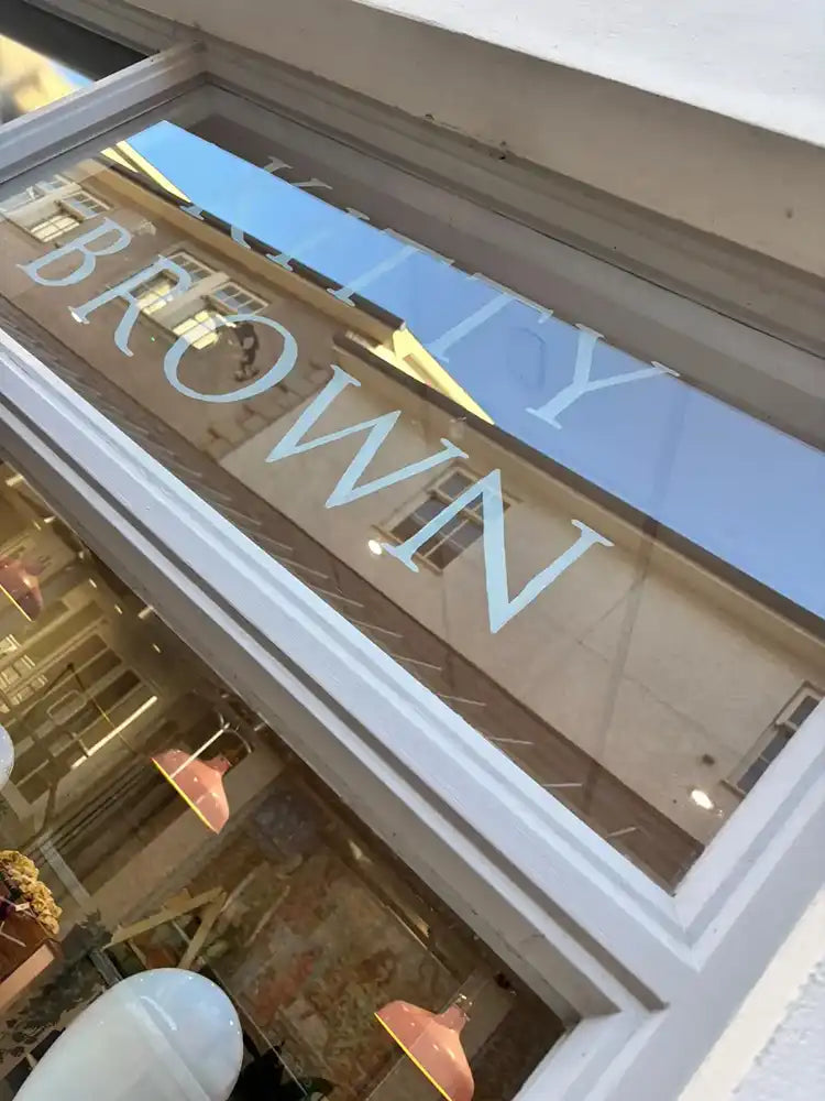 Kitty Brown painted on window at Elephant Yard, Kendal shop