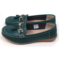 Joe and Jo moccasin style slip on, leather shoes in jasper green colour. Over the foot metallic gold coloured  detail and two matching tassels. Beige rubber soles. Side view.