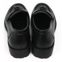 Emma black slip on loafer moccasin style shoes with two tassels on each. Carved, grippy soles. Back view.