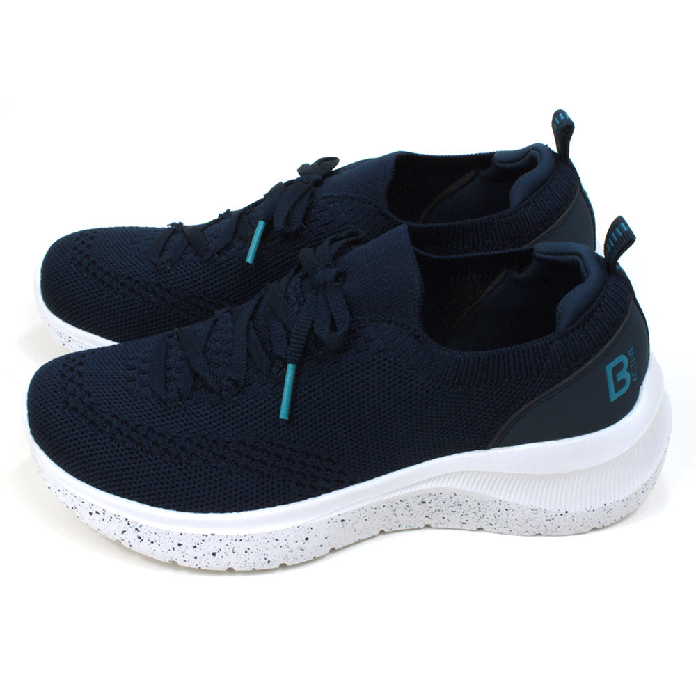 B Active navy blue slip on stretch fabric trainers with faux laces. Padded ankles. White speckled soles. Side view.