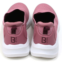 B Active pink slip on stretch fabric trainers. Padded ankles. White soles. Back view.