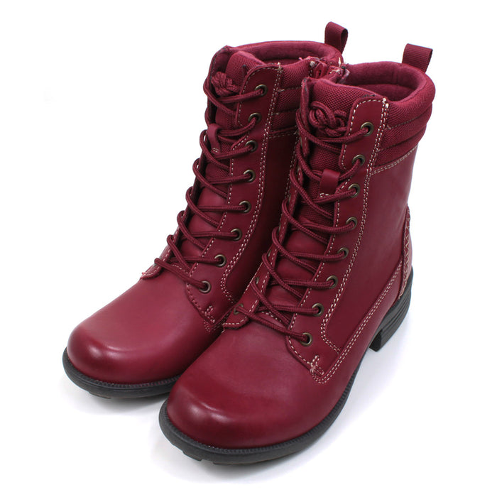 Free Spirit 8 holes lace up ankle boots in red. Low heels and dark coloured soles. Padded ankles and pull on tabs. Zipped fitting on the inside of the boots. Angled view