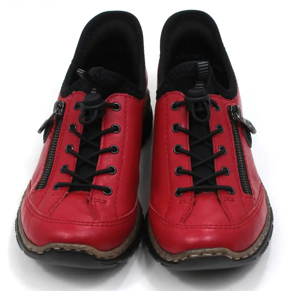 Rieker pull on red trainers with decorative zip. Elasticated black lace adjustment. Black rubber soles and black padded collars at ankles. Front view.