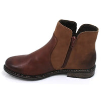 Rieker brown leather two tone brown ankle boots. Cross stitching detail over the ankle. Chelsea boots shape. One boot showing zip used for fastening the footwear.