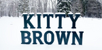 Text 'Kitty Brown' in large blue letters against a snowy forest background