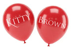 Two red balloons with 'Kitty Brown' printed on a white background