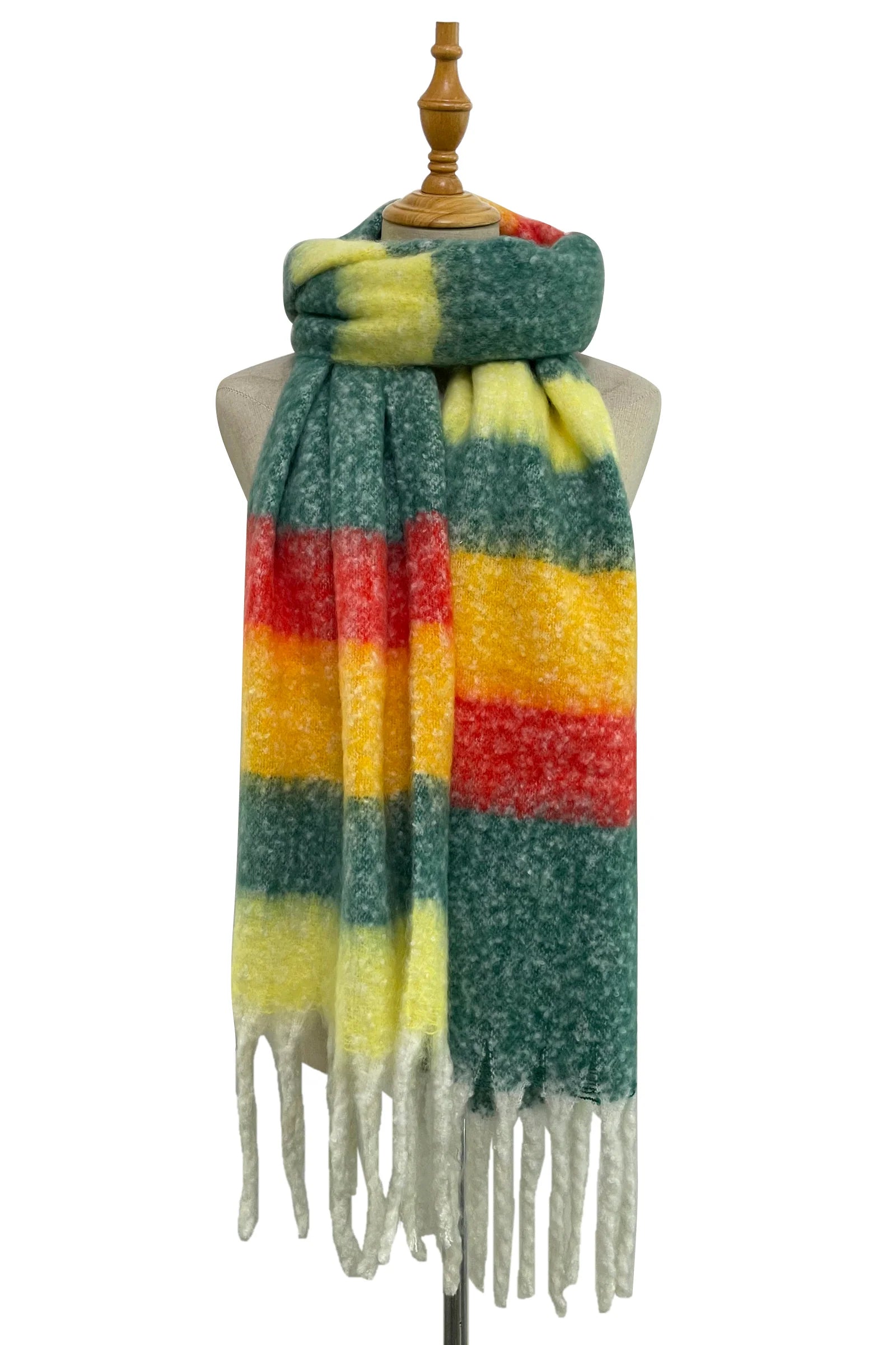 Red, green, orange and yellow striped scarf with fringes on a mannequin against a white background