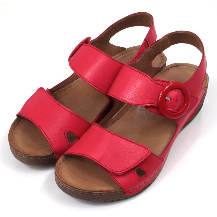 Adesso Lily sandals in salsa red. Double foot straps and ankle strap. Red buckle. Low heels. Angled view.