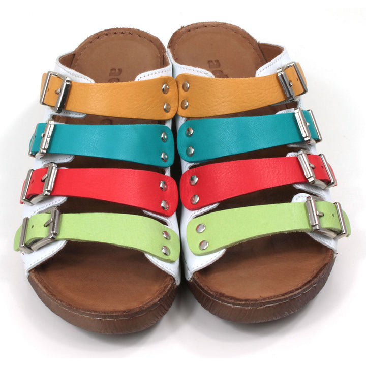 Adesso Zuri rainbow straps sandals. Four straps over the foot in mustard, teal, red and green. White leather upper. Low heels. Front view.