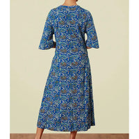 Blue patterned dress with elbow length bell sleeves and v neckline.
