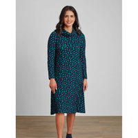 Navy based crinkled fabric knee length dress with a cowl neckline and long sleeves. Jade blue spotty print.