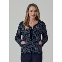 Navy based open edge to edge jacket with beige flowers. Round neckline and long sleeves with patch pockets on the hip.