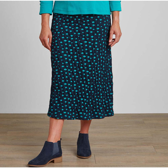 Front of Midcalf length navy and ade green spotted A line skirt with navy Chelsea boots