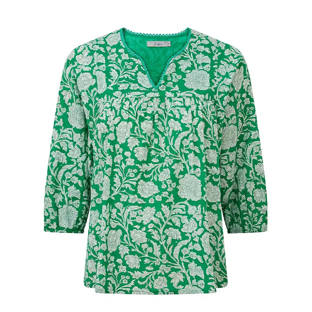 Green floral patterned blouse on a white background