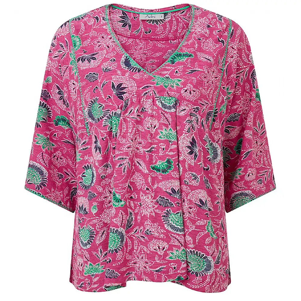 Pink blouse with green and black floral pattern on a white background