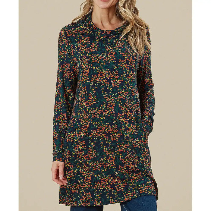 Woman wearing a long floral dress against a beige background