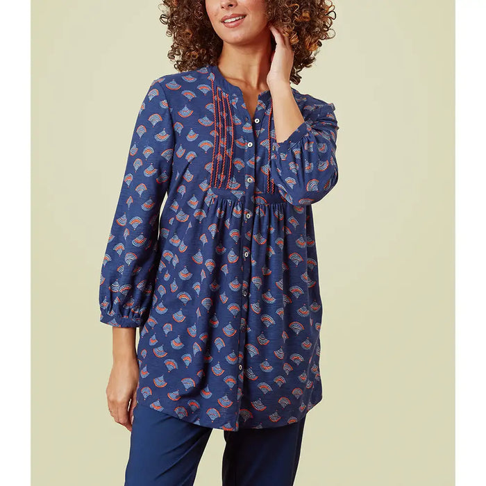 Three quarter length sleeves with pintuck detailing and buttons down the front. Blue base with multi coloured fans. 