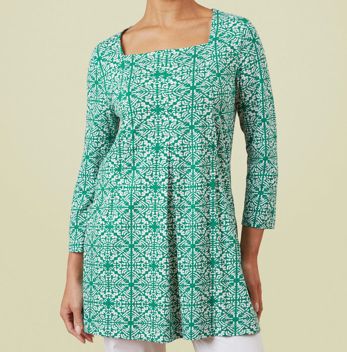 Squared neckline, 3 quarter length sleeves with a gentle flare. Green tile print. 