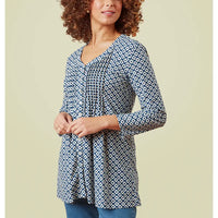 Geometric print tunic with three quarter length sleeves. V neckline. Ruched detailing on bust. 
