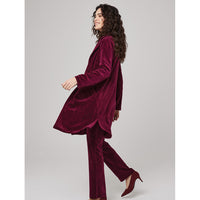 Side of long line plum coloured velvet jacket with a side split and long sleeves.