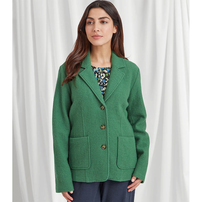 Front of woolen bright reen blazer style jacket, with long sleeves, v neckline that leads to 3 buttons, shirt style lapels and patch pockets on the front hip bone area.