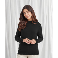 Plain black high necked long sleeve jumper with contrasting ribbed hem and cuffs. Scalloped hem at waistline. 