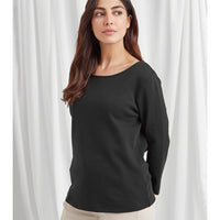 Plain black tee with a boat neckline and long sleeves on a white curtain bckground.