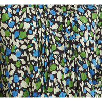 Splash print blouse with the colours of sage green, azure blue and beige splats on a black background. 