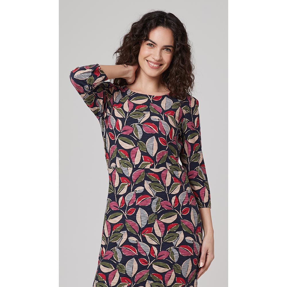 Navy blue based tunic with a boat neckline and three quarter length sleeves. Featuring a leaf print that has pink, beige, green and red. 