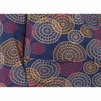 Royal Blue based fabric with circle and spot print in red, yellow and white. 