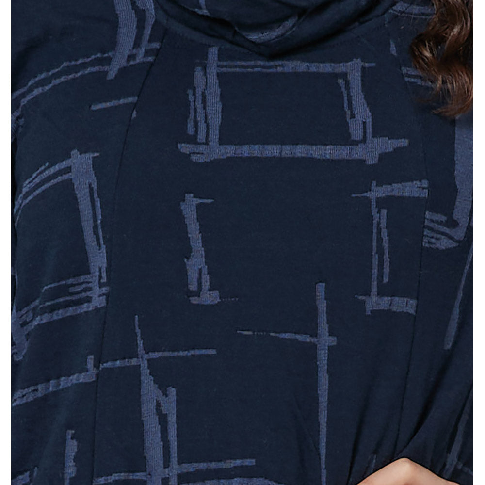 A dark navy bue material with a broken paler blue squared print on it. 