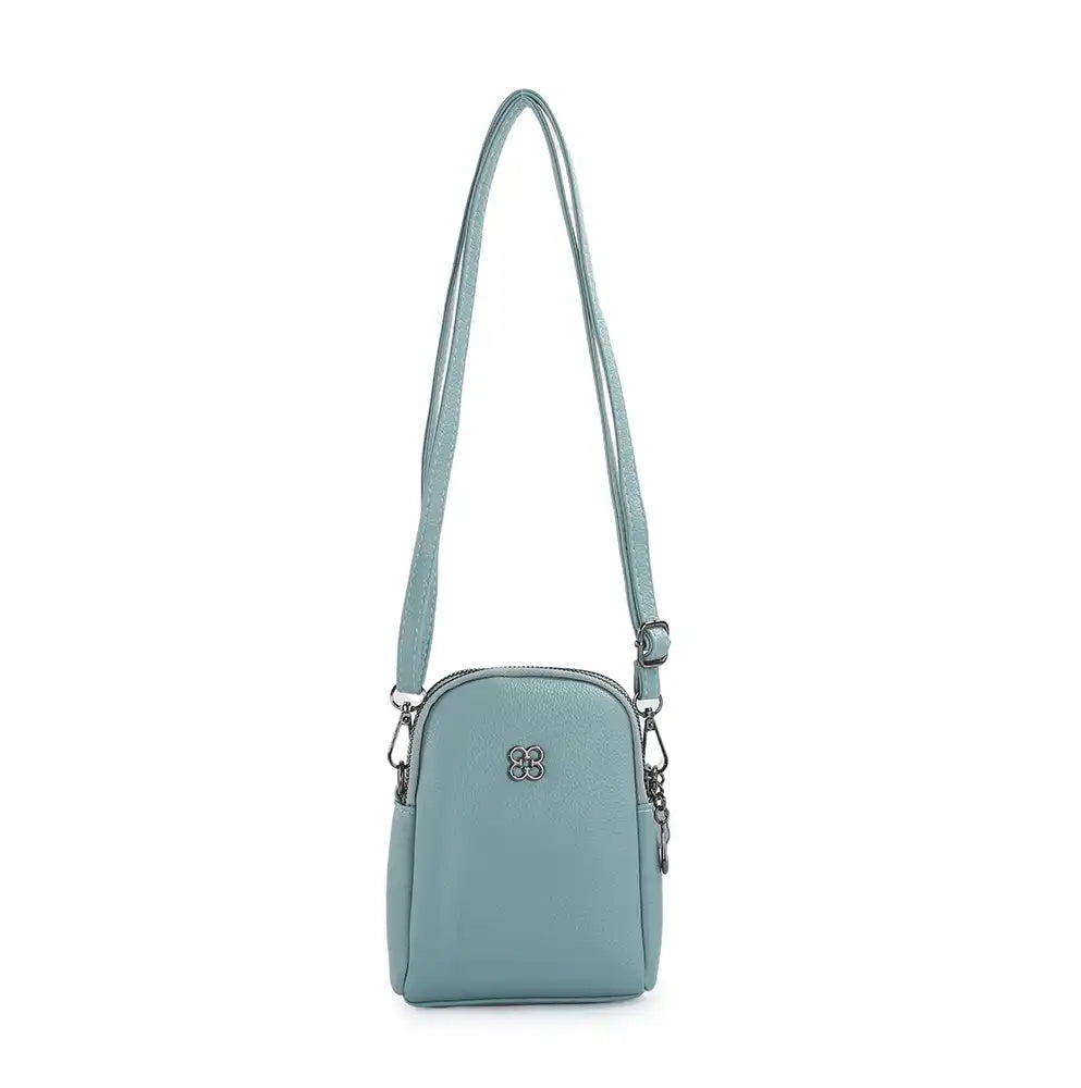 A light blue crossbody bag with a long shoulder strap, silver-tone hardware, and a small metallic logo emblem on the front, shown against a plain white background.