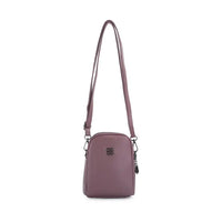 A small, dome-shaped crossbody bag in a dusty mauve purple color, featuring a matching adjustable shoulder strap, a front zippered pocket, and a small black metal logo emblem on the front, set against a plain white background.