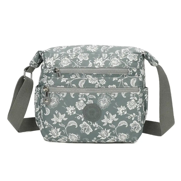 Floral patterned shoulder bag on a white background