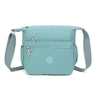 Light blue crossbody bag on a white background