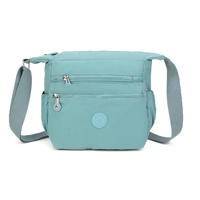 Light blue crossbody bag on a white background