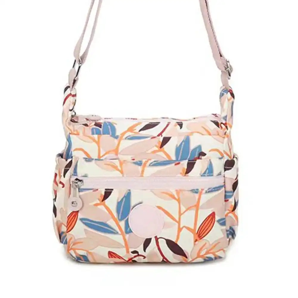 Floral patterned shoulder bag on a white background