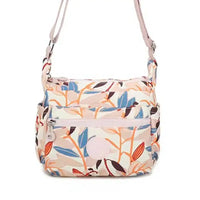 Floral patterned shoulder bag on a white background