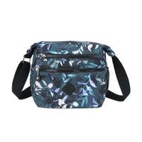 Floral patterned crossbody bag on a white background