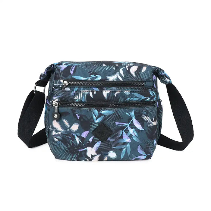 Floral patterned crossbody bag on a white background