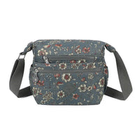 Floral-patterned crossbody bag on a white background