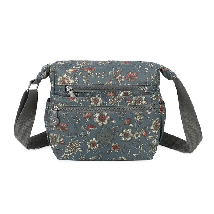 Floral-patterned crossbody bag on a white background