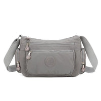 Gray shoulder bag with a visible brand logo on a white background