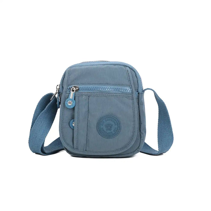 Blue crossbody bag on a white background