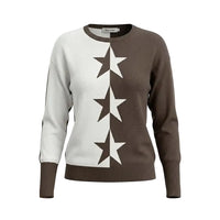 A women's crewneck sweater with a color-blocked design of white and dark brown, featuring three large white stars knitted vertically down the center. The brand name 'Maja & C' is visible on the inner neck label.